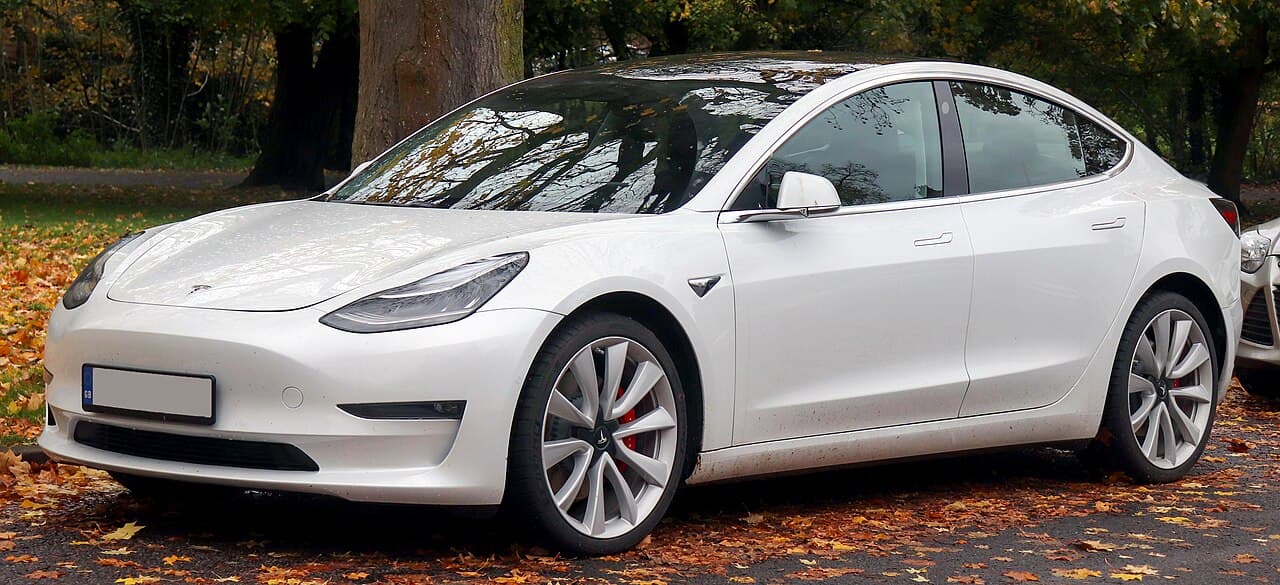 Tesla Model 3 Long Range AWD electric sedan exterior, front three-quarter view.