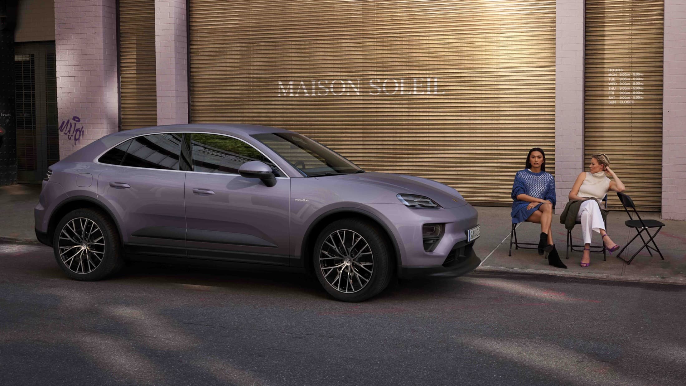 Porsche Macan 4 Electric electric SUV exterior, side profile view.